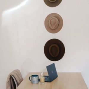 cobalt blue microsoft surface laptop computer on brown wooden table