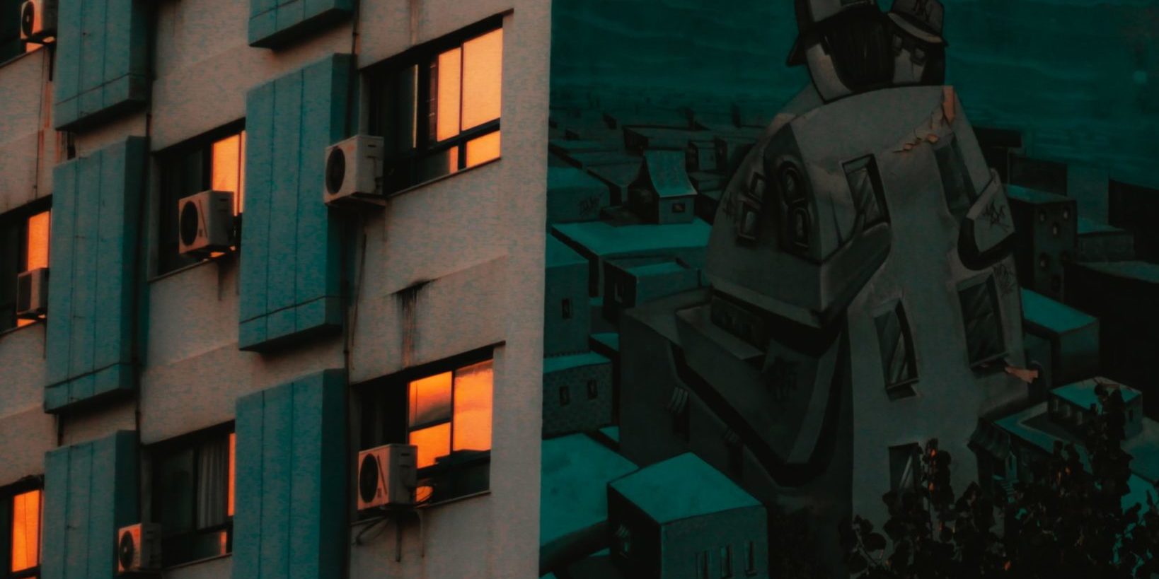 Photo by Nafsika G. man in black jacket standing beside building