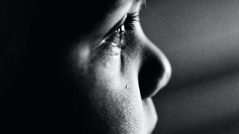 grayscale photo of mans face