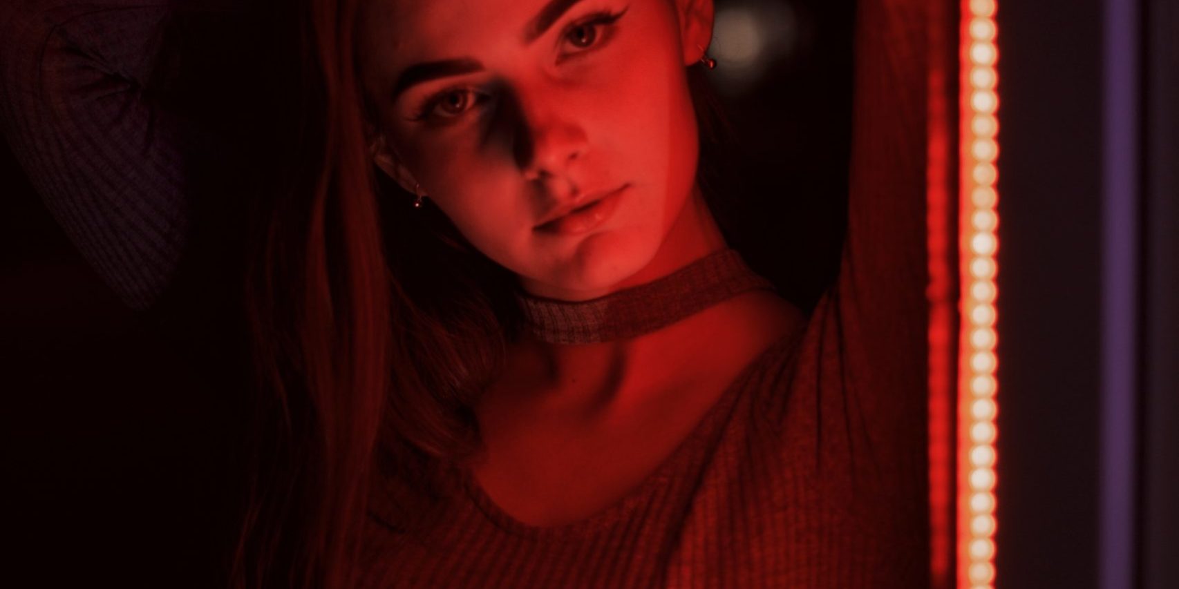 woman in red turtleneck shirt