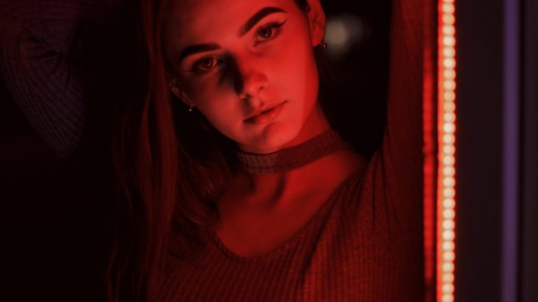 woman in red turtleneck shirt