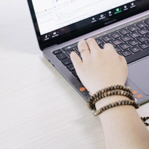 person using black and silver laptop computer