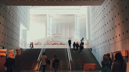 a group of people standing in a lobby
